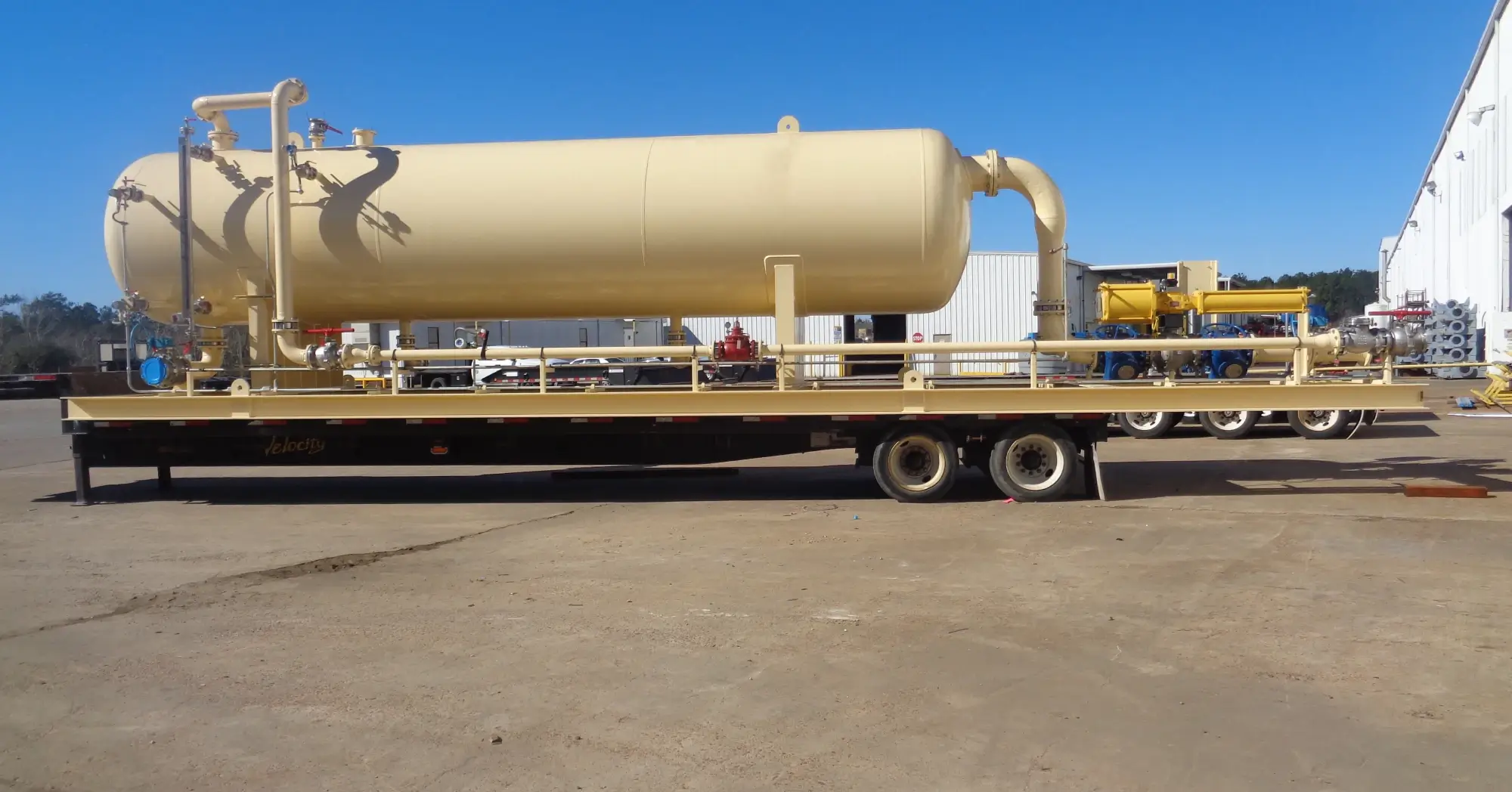 Horizontal oil and gas separator on a skidded flatbed trailer, ready for transport to a well site